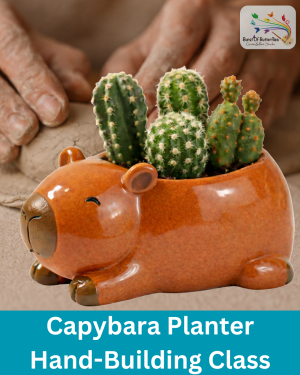 Hand-built clay capybara planter with glossy brown glaze holding small cactus plants at Burst of Butterflies Peoria